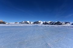 11A Looking Down The Hard Blue Ice Of Union Glacier Runway In Antarctica To Rhodes Bluff, Lester Peak On Edson Hills On The Way To Climb Mount Vinson.jpg
